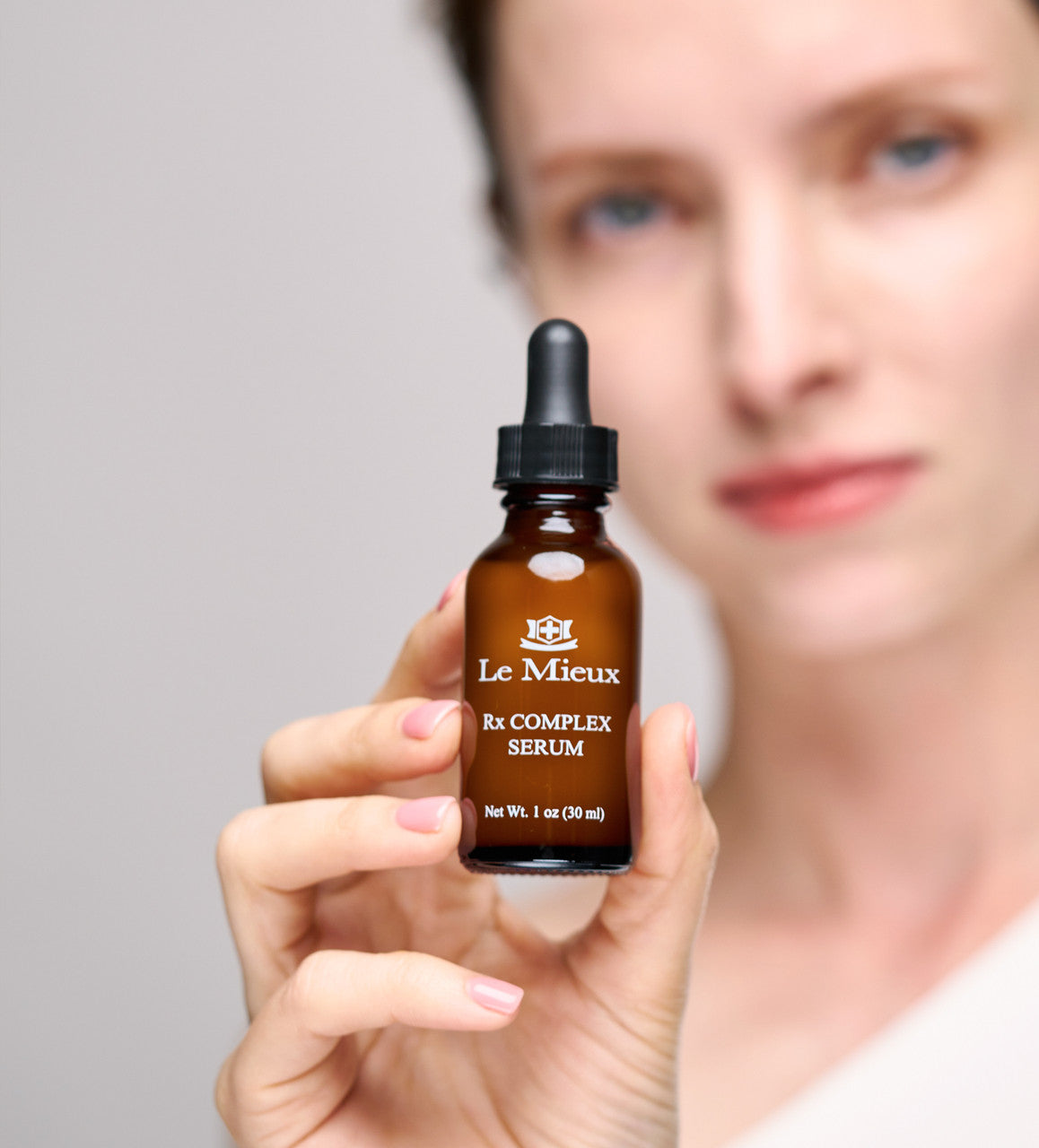 girl holding Le Mieux RX Complex Serum